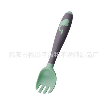 Baby learning to eat spoon and fork